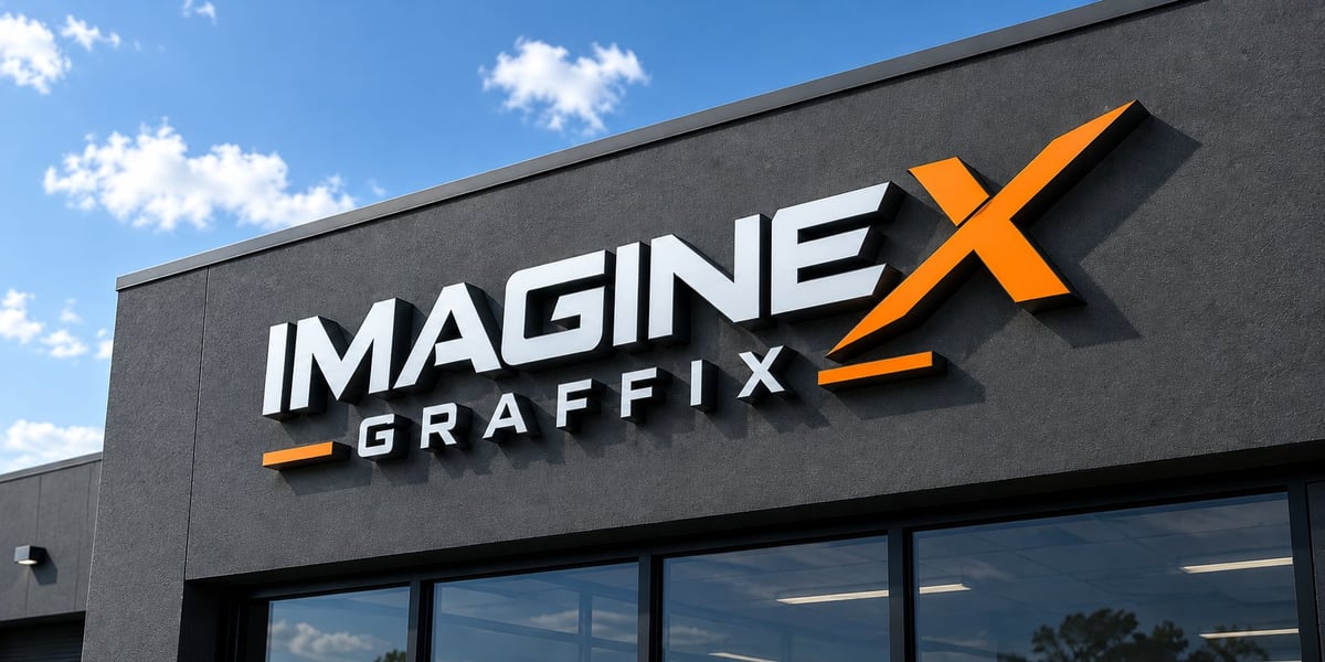 Imagine Graffix 3D fabricated storefront sign mounted on a dark building fascia in daylight, Pretoria